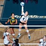 SCOTT ROEDER | Staff PhotographerKari Pestolesi (4) spikes the ball against Cal State Fullerton as Kristin Winkler (12) looks on. UCI wins 3-0.