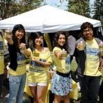 Claudia cheffs | Staff Photographer Grace Poon, a third-year economics major who was running against Jun Wang for the role of Vice President of Student Services, campaigns with the help of some friends on Ring Road, passing out personalized water bottles to encourage people to vote.