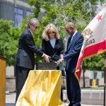 photo courtesy of jason davis Bill and Sue Gross of the Newport-based PIMCO, one of the world’s largest investment management firms, assist Chancellor Drake in flipping a switch that unveiled a banner outside of the Sue and Bill Gross Stem Cell Research Center on Friday, May 14 for the building’s dedication.